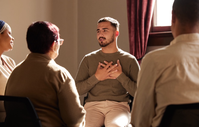A man sharing openly in a peer support circle